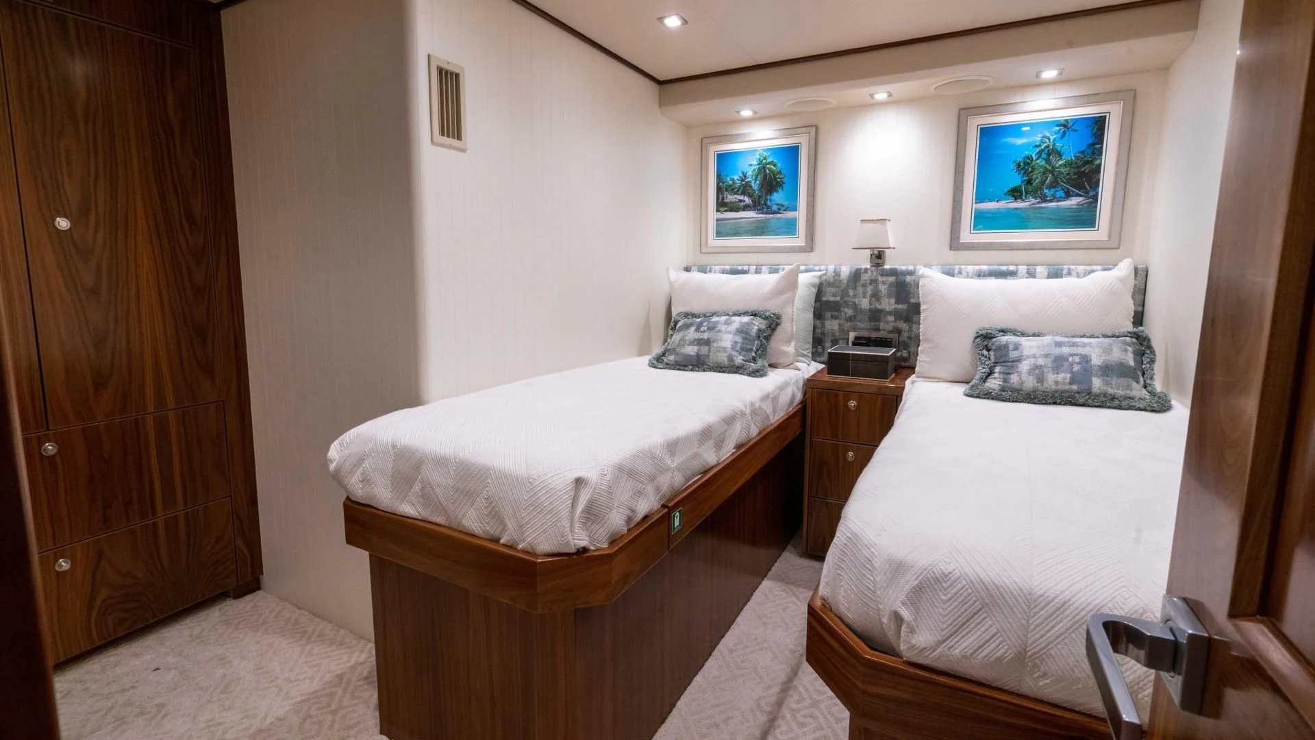 a couple of beds in a hotel room aboard OBSESSION Yacht for Sale