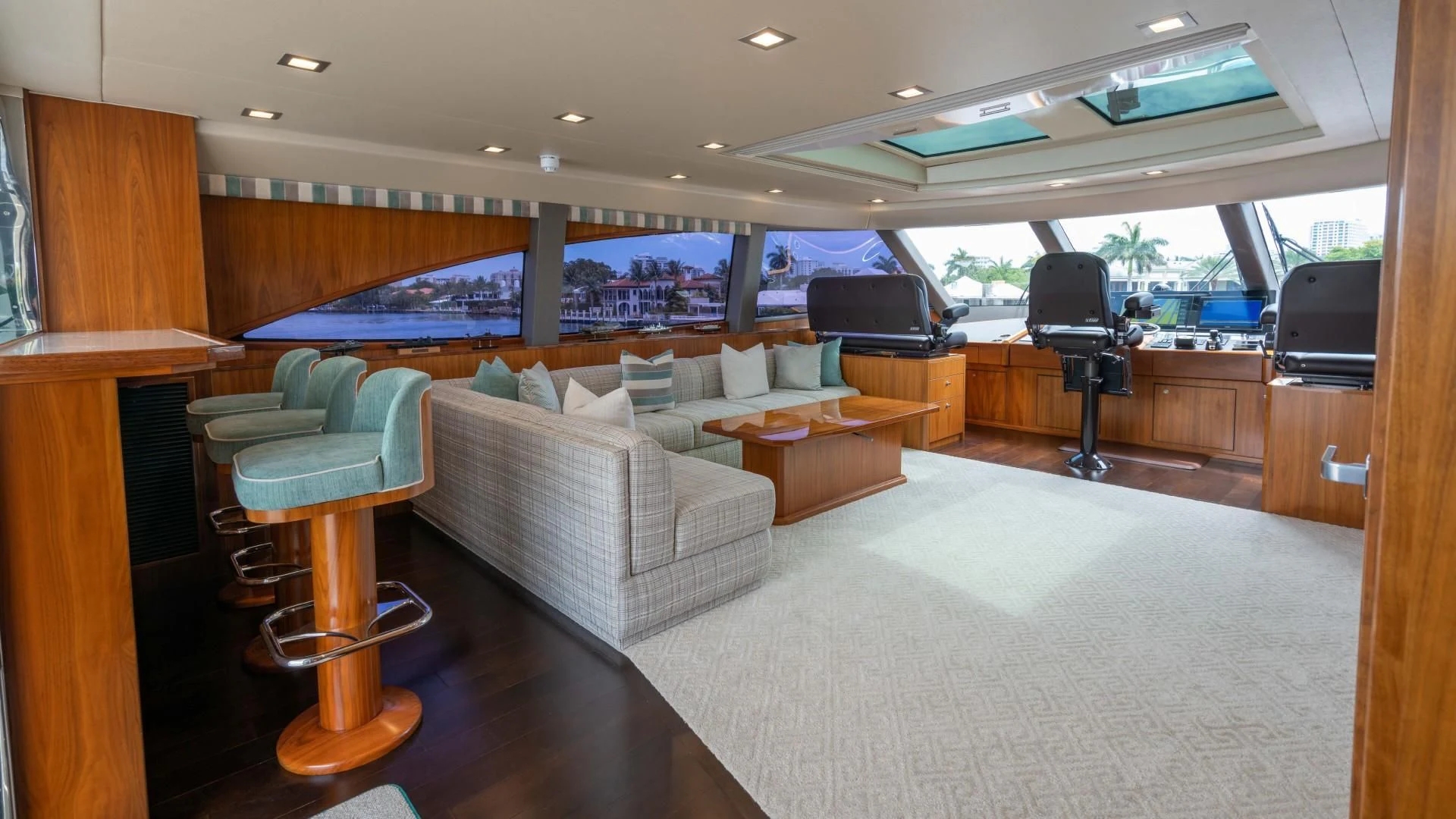 a living room with a large window aboard OBSESSION Yacht for Sale