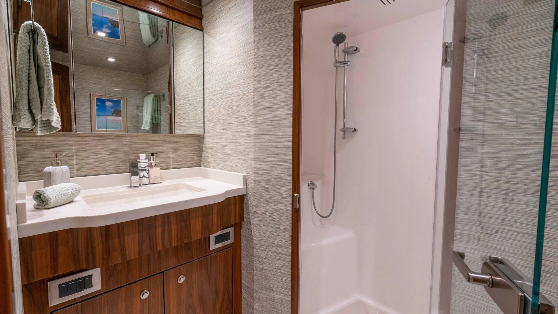 a bathroom with a sink and a shower aboard OBSESSION Yacht for Sale
