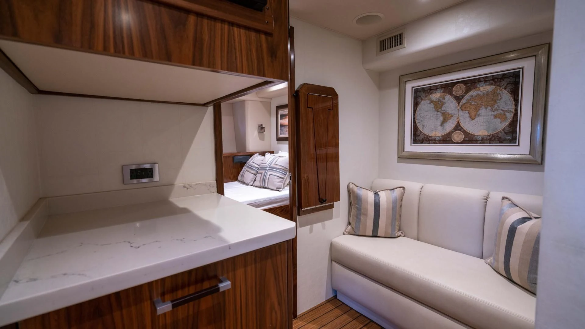a room with a bed and a sink aboard OBSESSION Yacht for Sale