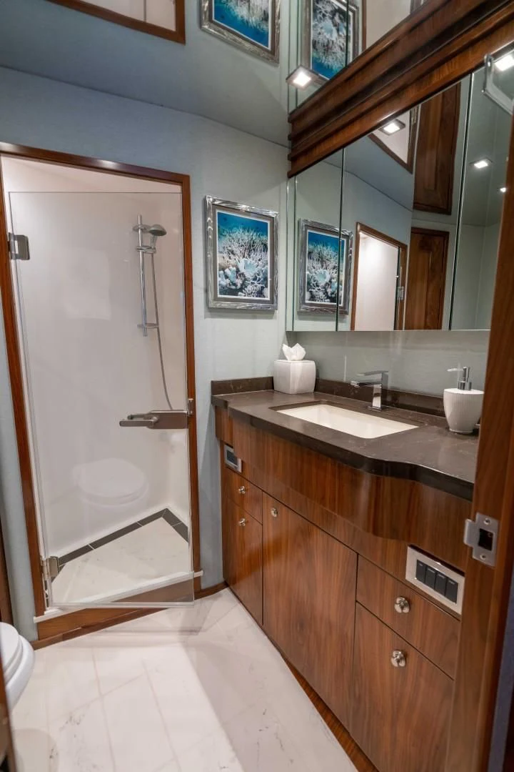 a bathroom with a large mirror aboard OBSESSION Yacht for Sale