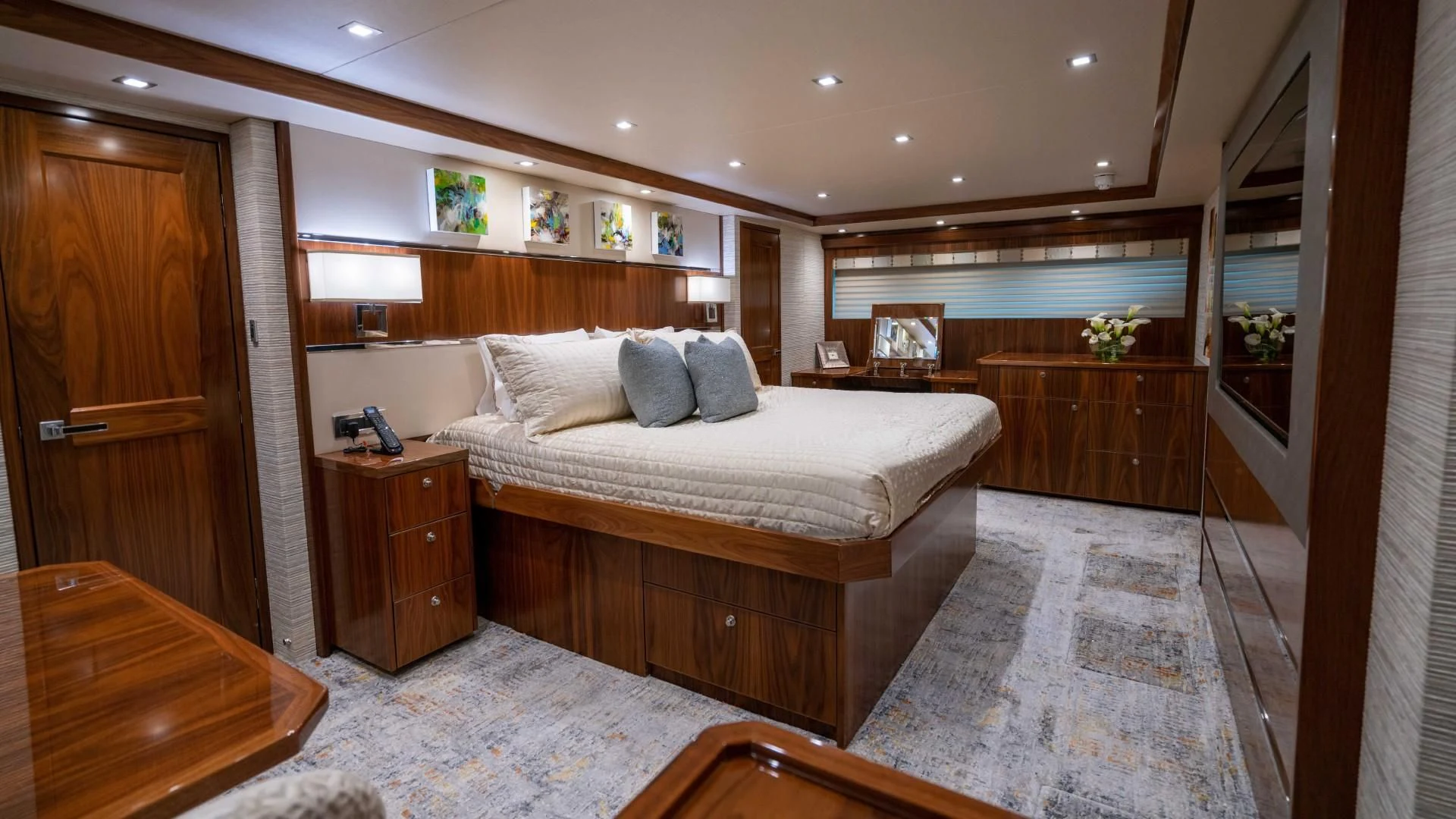 a bedroom with a large bed aboard OBSESSION Yacht for Sale
