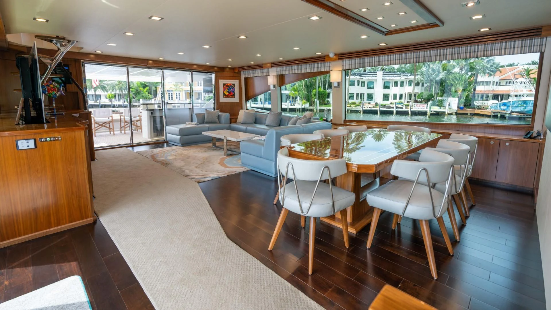 a large room with a table and chairs aboard OBSESSION Yacht for Sale