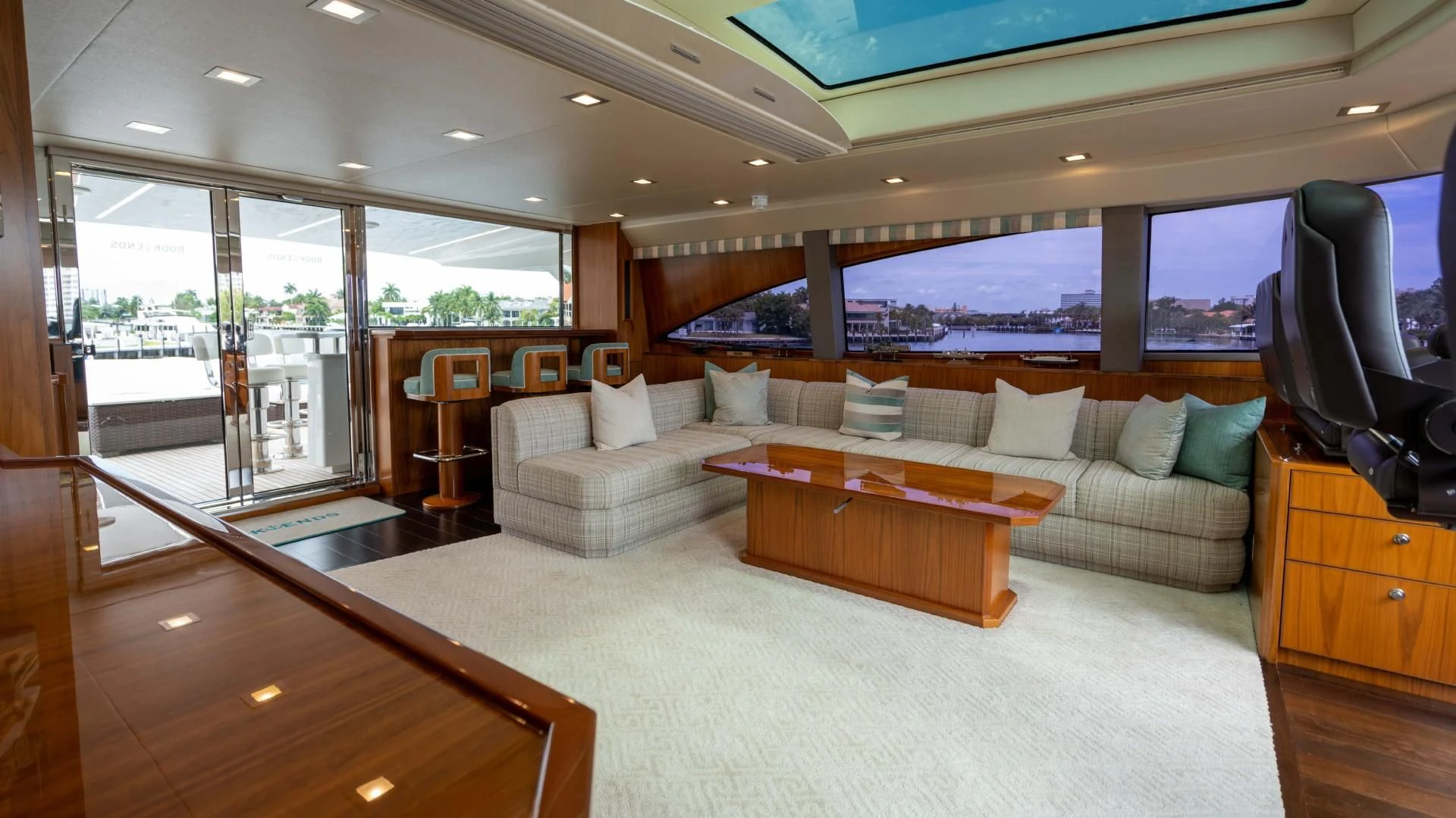 a living room with a large window aboard OBSESSION Yacht for Sale