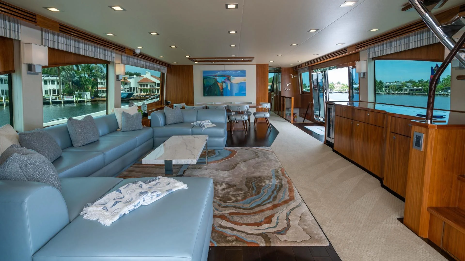 a living room with a large window aboard OBSESSION Yacht for Sale