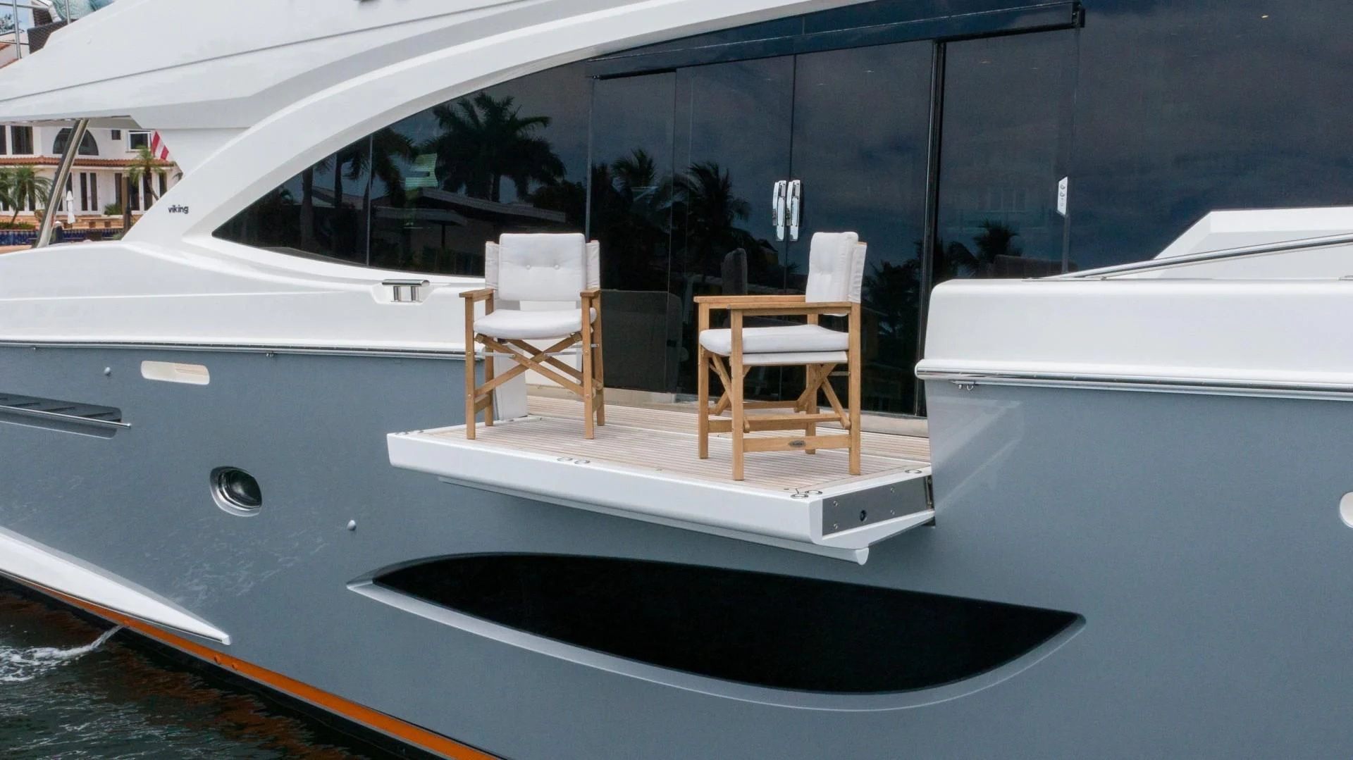 a boat with chairs on the deck aboard OBSESSION Yacht for Sale