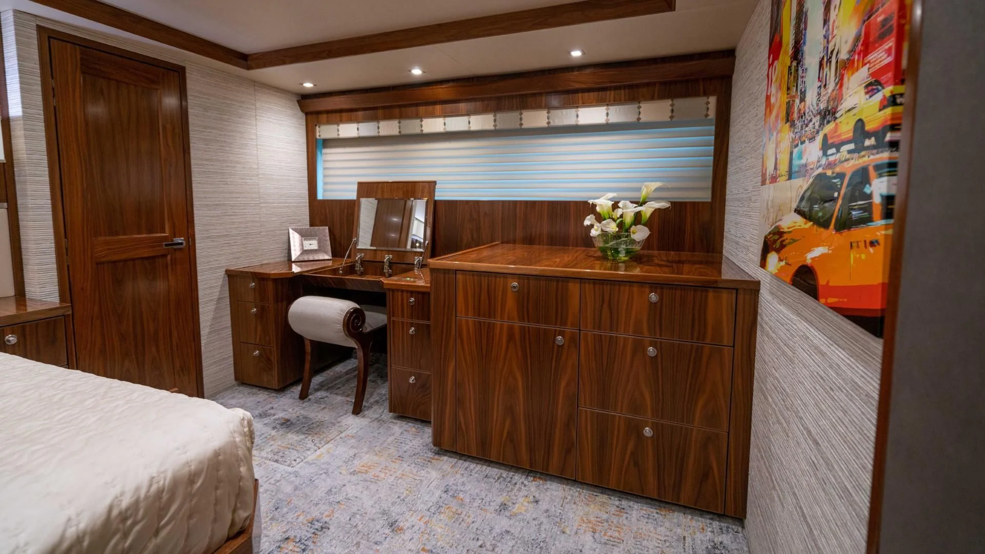 a room with a desk and a bed aboard OBSESSION Yacht for Sale