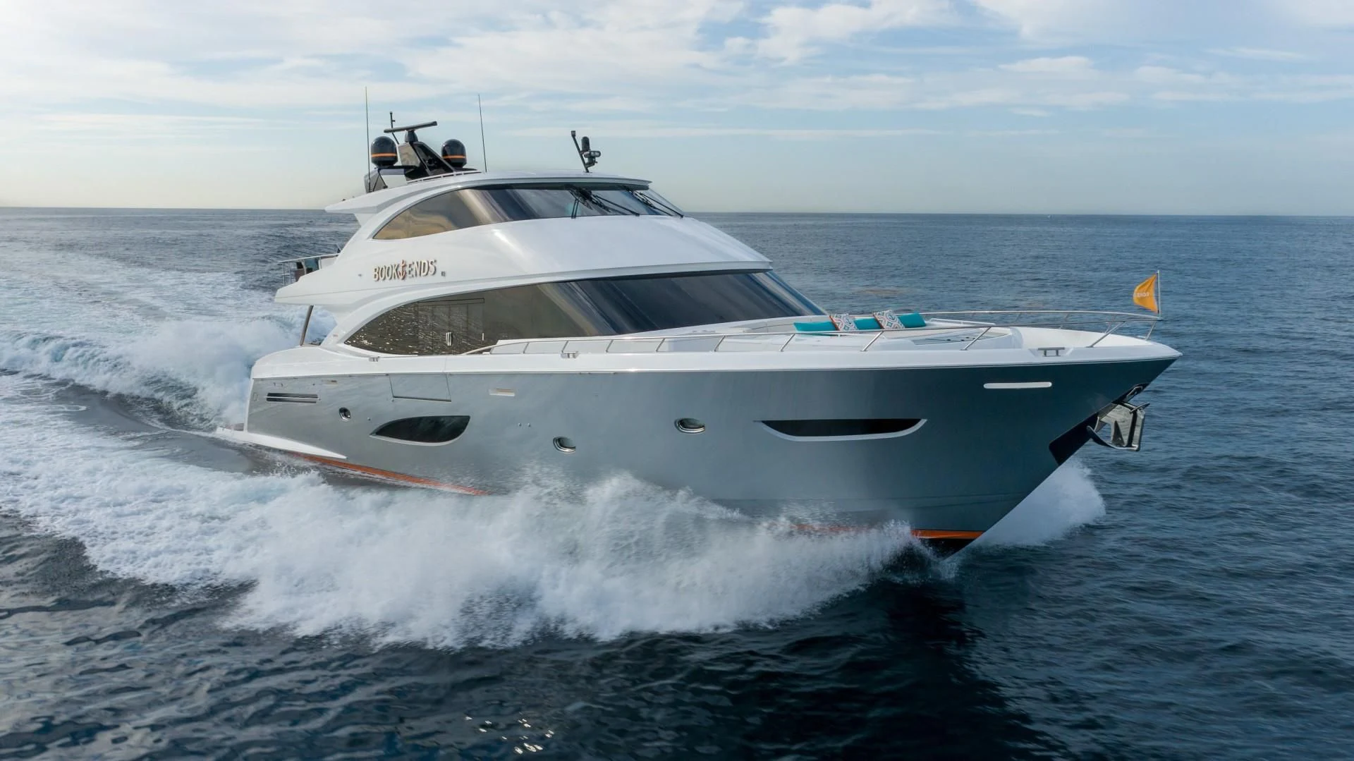 a white yacht on the water aboard OBSESSION Yacht for Sale