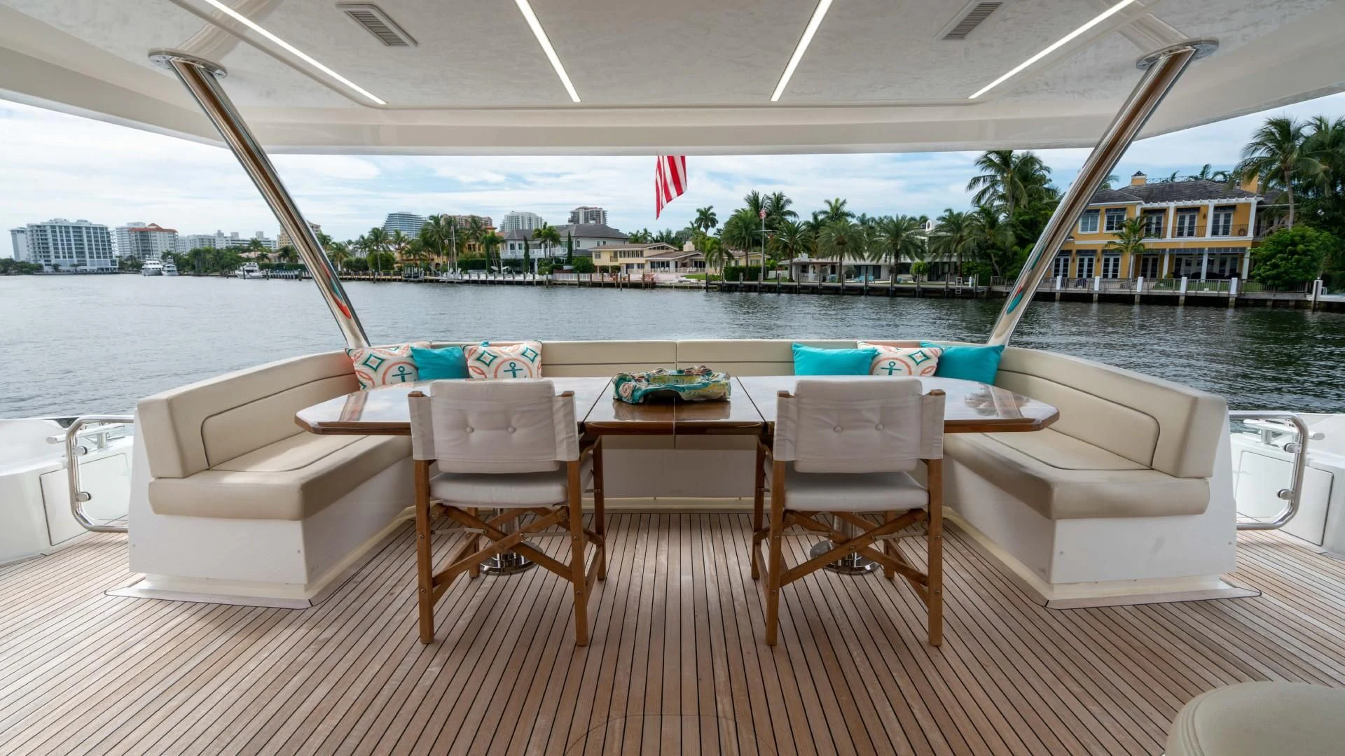 a table and chairs on a deck aboard OBSESSION Yacht for Sale