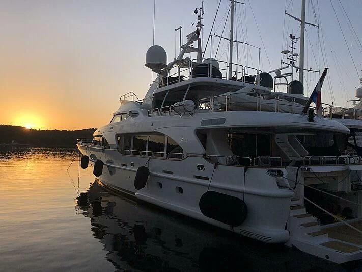 a boat docked at sunset aboard SOGNO Yacht for Sale