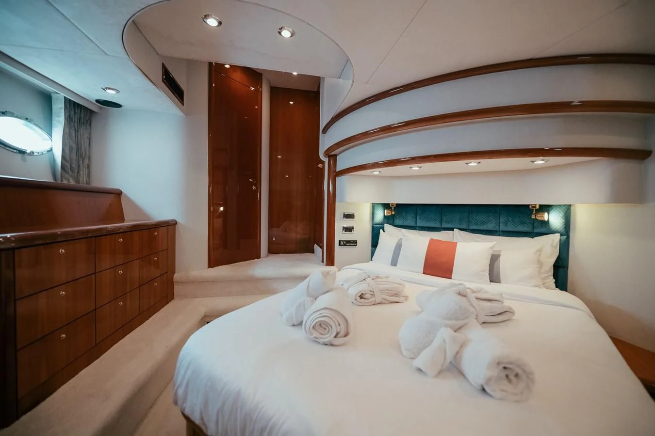 a bed with white sheets aboard HOURI Yacht for Sale