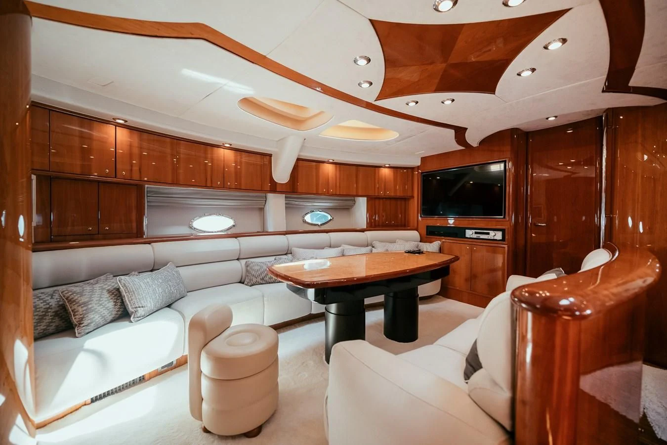 a living room with a couch and a table aboard HOURI Yacht for Sale
