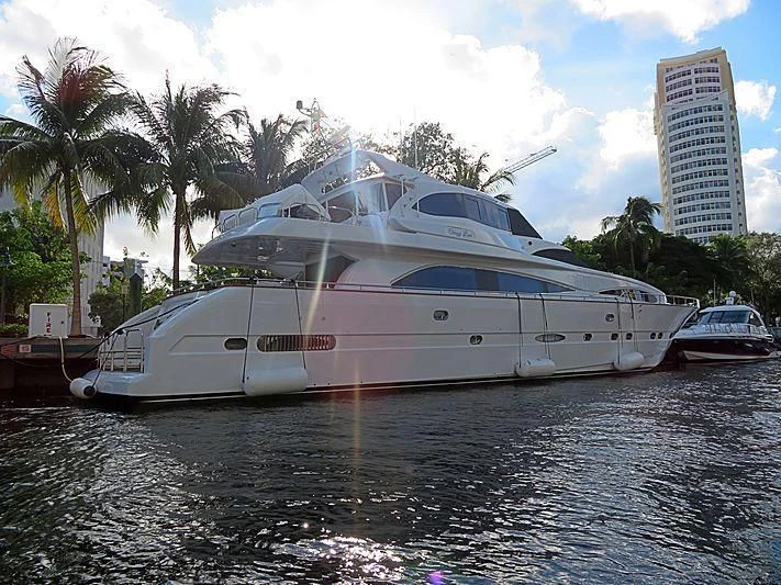 a large white yacht docked aboard CRAZY LOVE Yacht for Sale