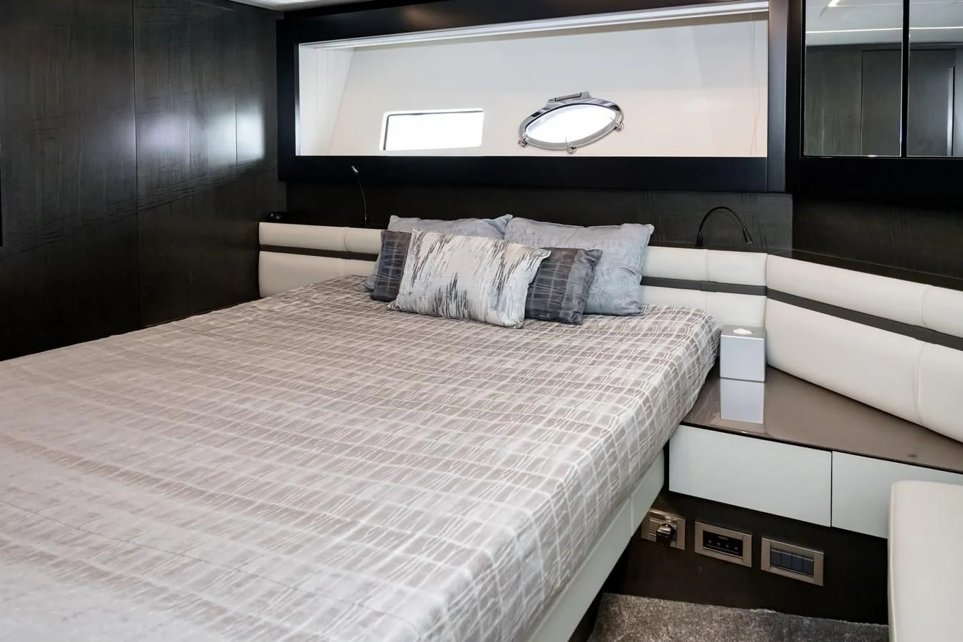 a bed with a white sheet aboard QUEEN B SPORT Yacht for Sale
