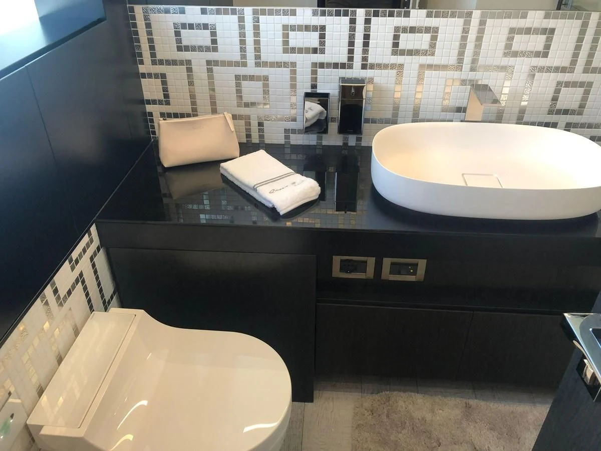 a bathroom with a sink and toilet aboard QUEEN B SPORT Yacht for Sale