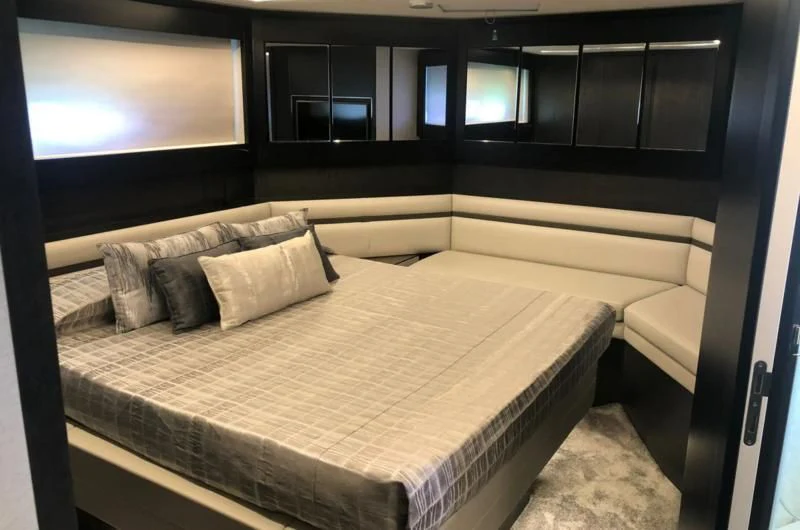 a bed with pillows aboard QUEEN B SPORT Yacht for Sale