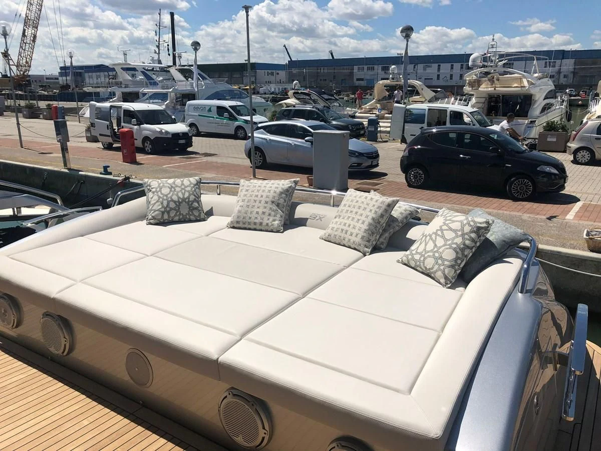 a white couch with pillows aboard QUEEN B SPORT Yacht for Sale