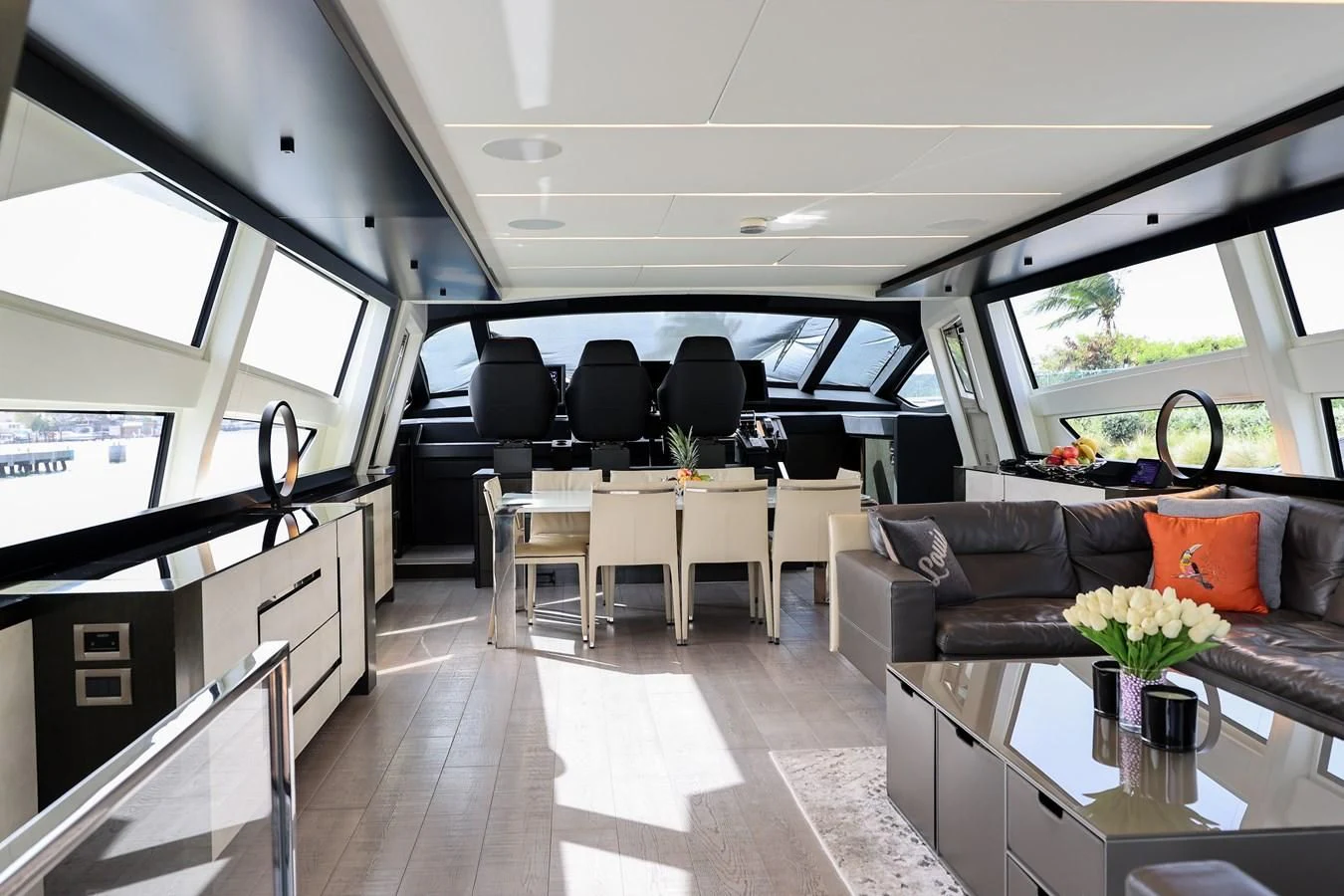 inside of a vehicle with a table and chairs and a couch aboard QUEEN B SPORT Yacht for Sale