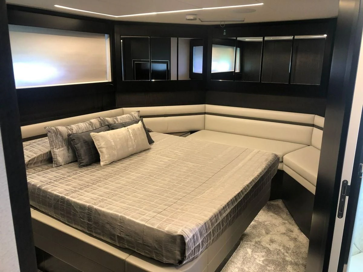 a room with a bed and a tv aboard QUEEN B SPORT Yacht for Sale