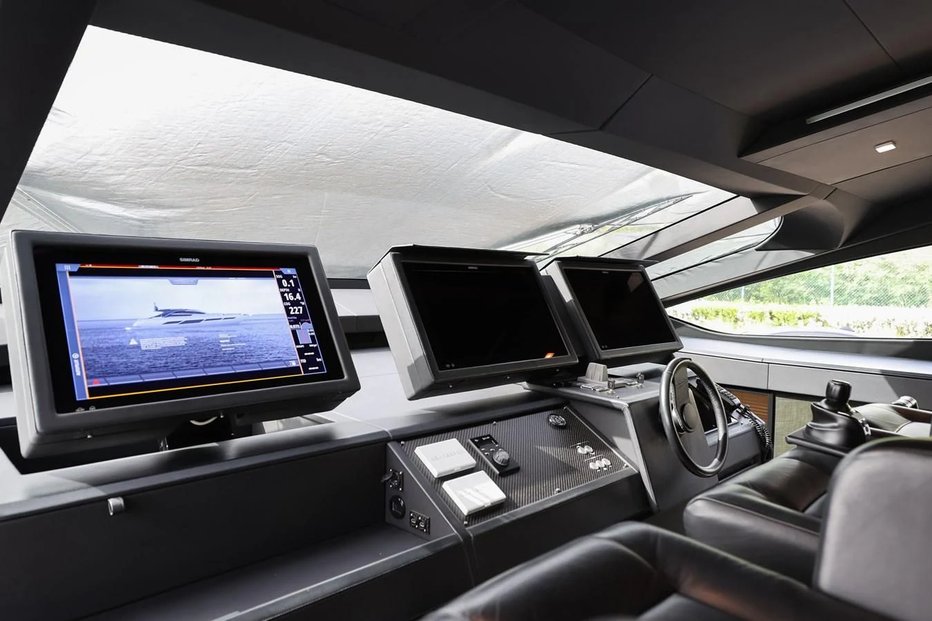 a car with computers on the dashboard aboard QUEEN B SPORT Yacht for Sale