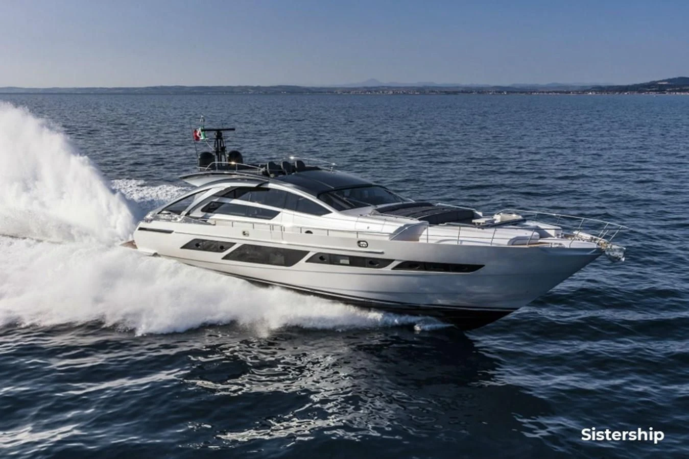 a white yacht on the water aboard QUEEN B SPORT Yacht for Sale