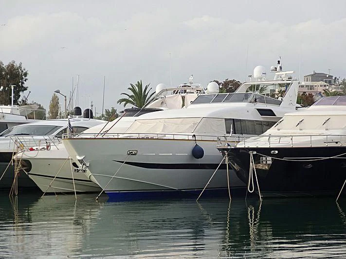 several white yachts in a harbor aboard PANAMA BLUE Yacht for Sale