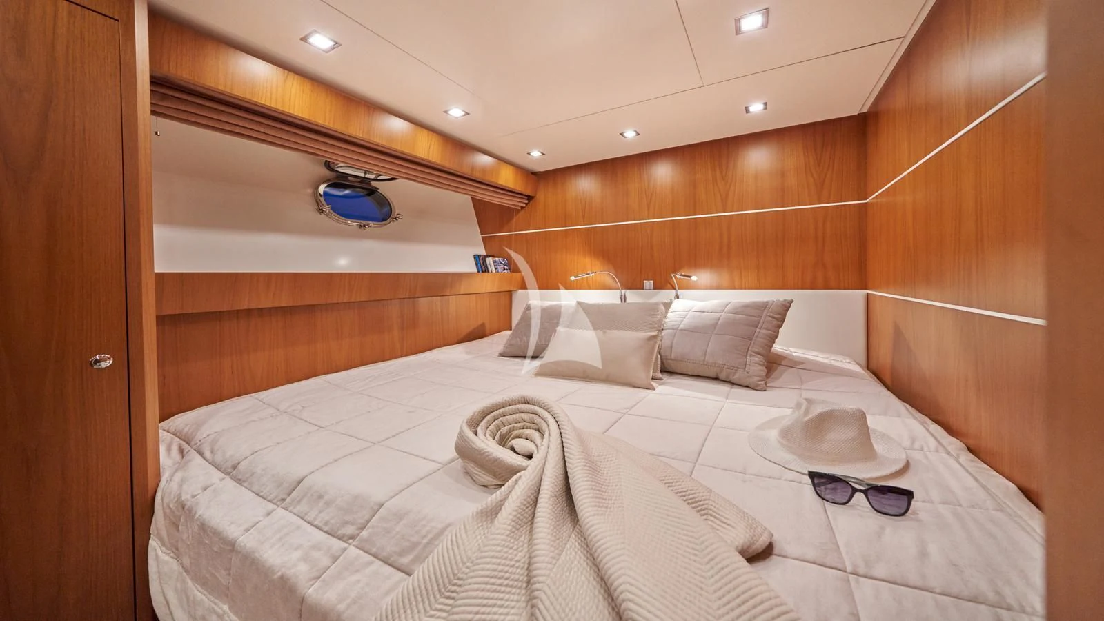 a room with a bed and a wood wall aboard KARISMA Yacht for Sale