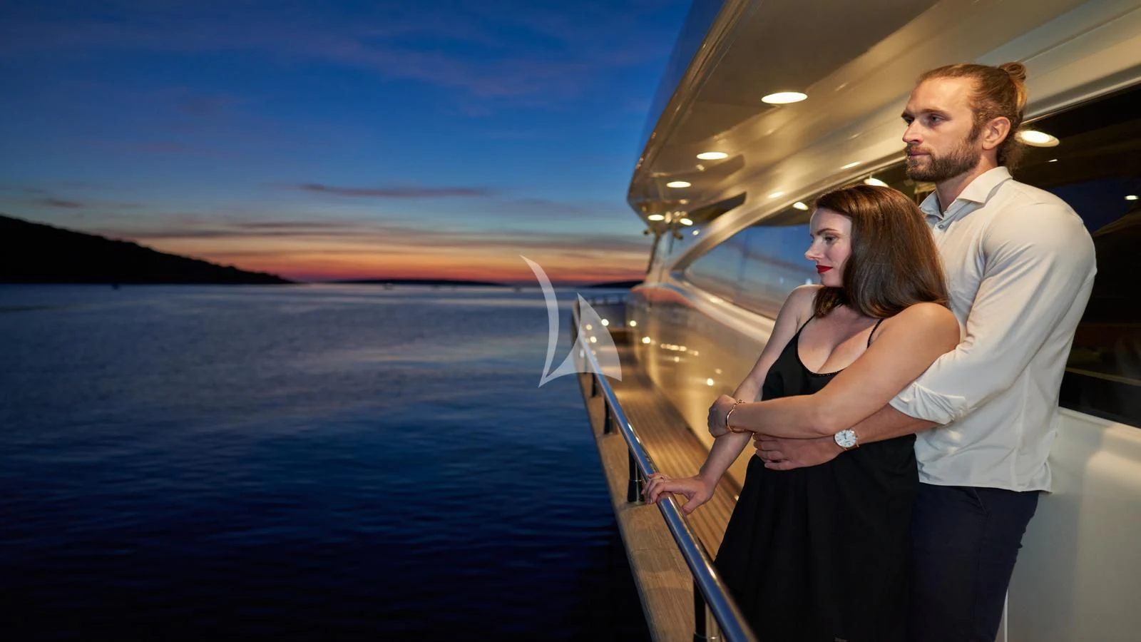 a man and woman holding hands on a boat aboard KARISMA Yacht for Sale
