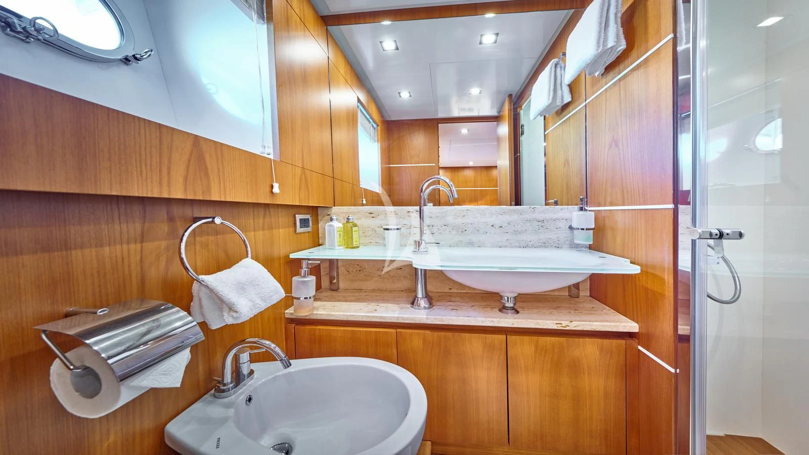 a bathroom with a sink and a mirror aboard KARISMA Yacht for Sale