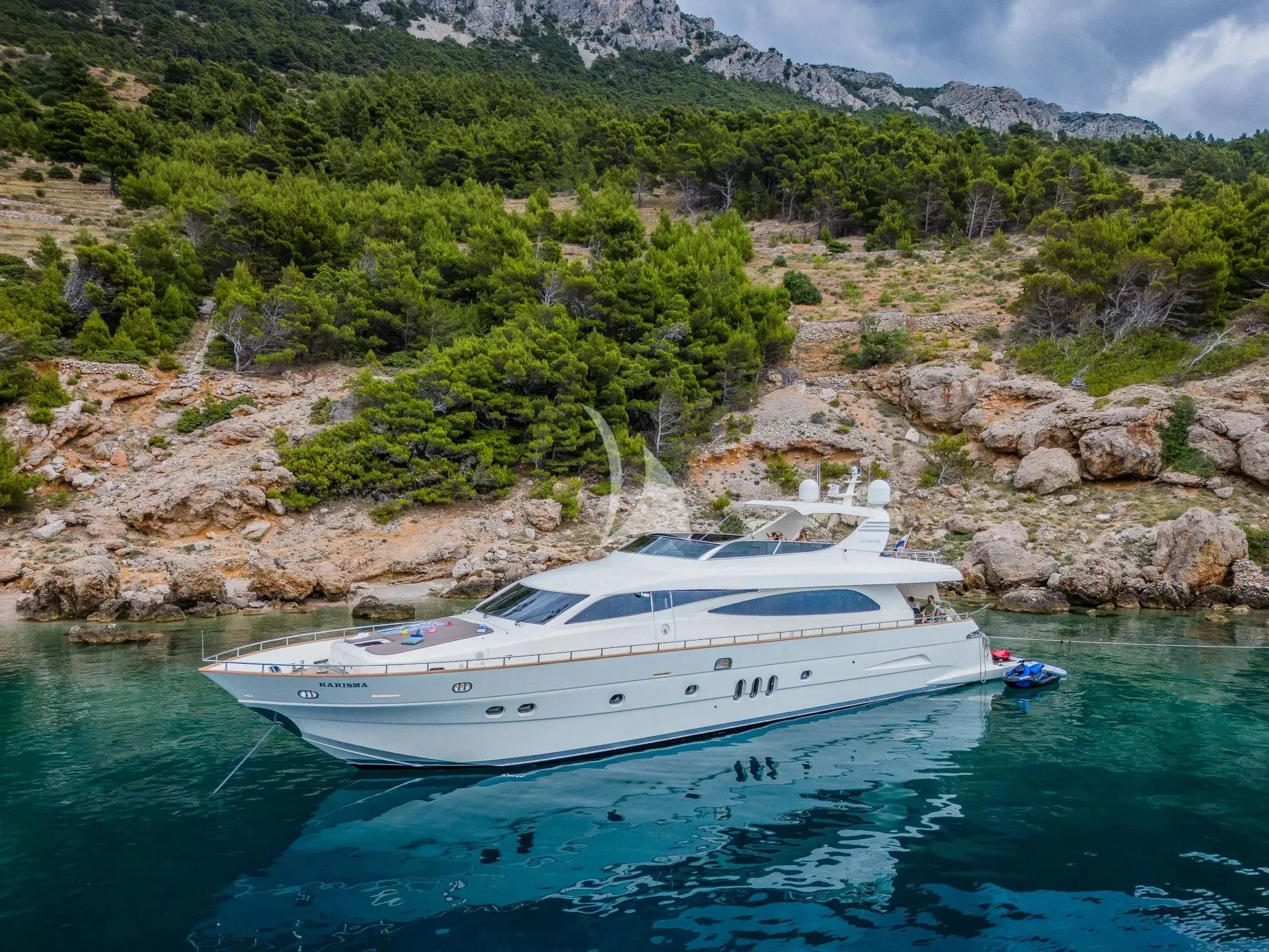 a white boat on water aboard KARISMA Yacht for Sale