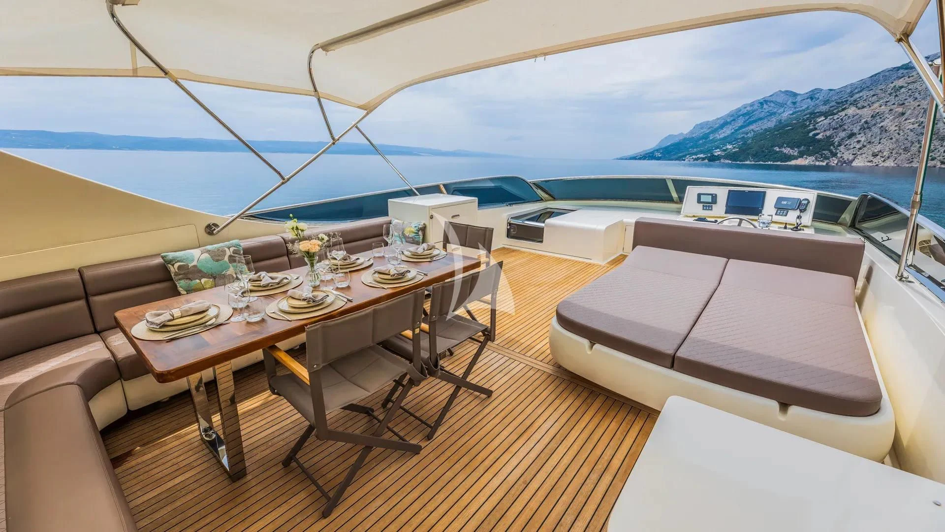 a room with a table and chairs aboard KARISMA Yacht for Sale