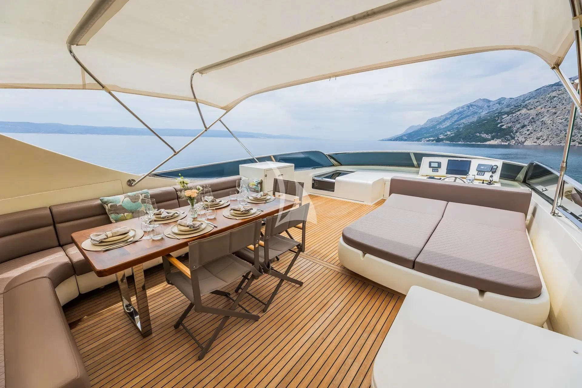a room with a table and chairs aboard KARISMA Yacht for Sale