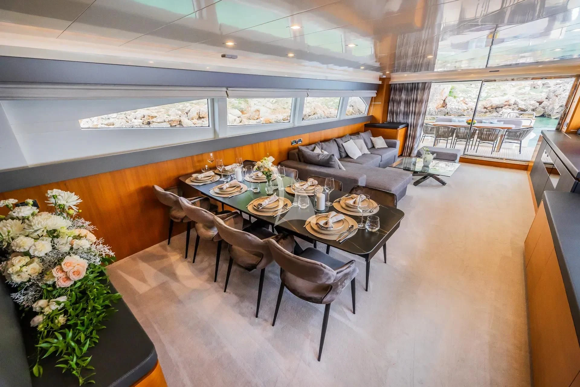 a dining room with a table and chairs aboard KARISMA Yacht for Sale