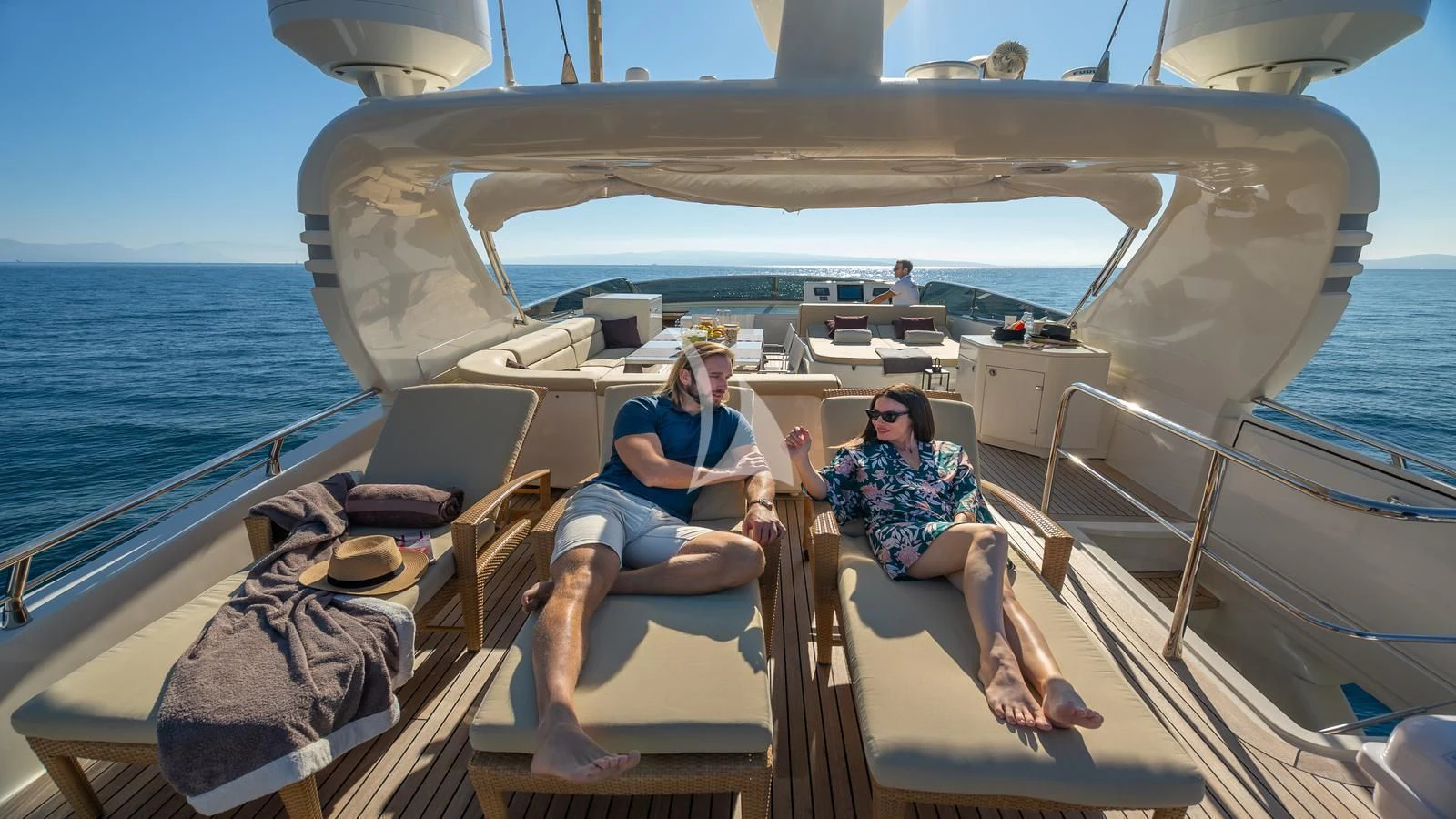 a couple of women sitting on a boat aboard KARISMA Yacht for Sale