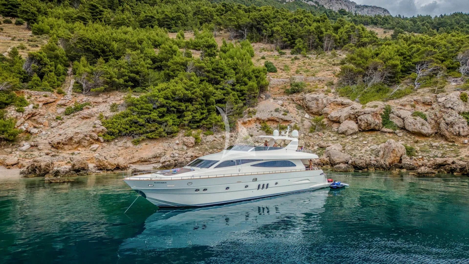 a white boat on the water aboard KARISMA Yacht for Sale