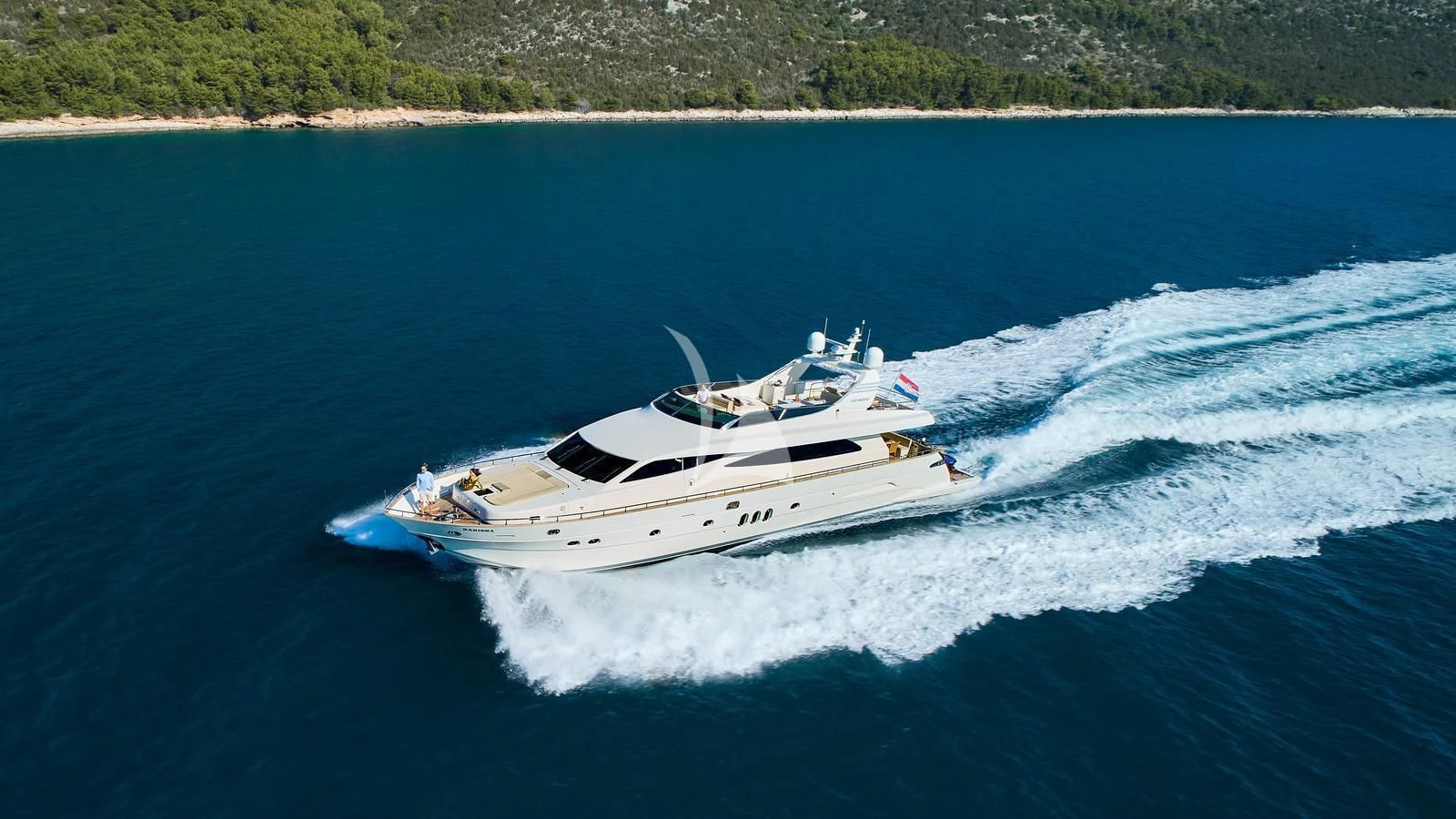 a white yacht on water aboard KARISMA Yacht for Sale