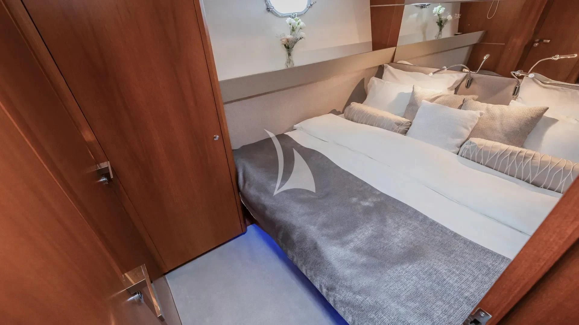 a bed with white sheets aboard KARISMA Yacht for Sale