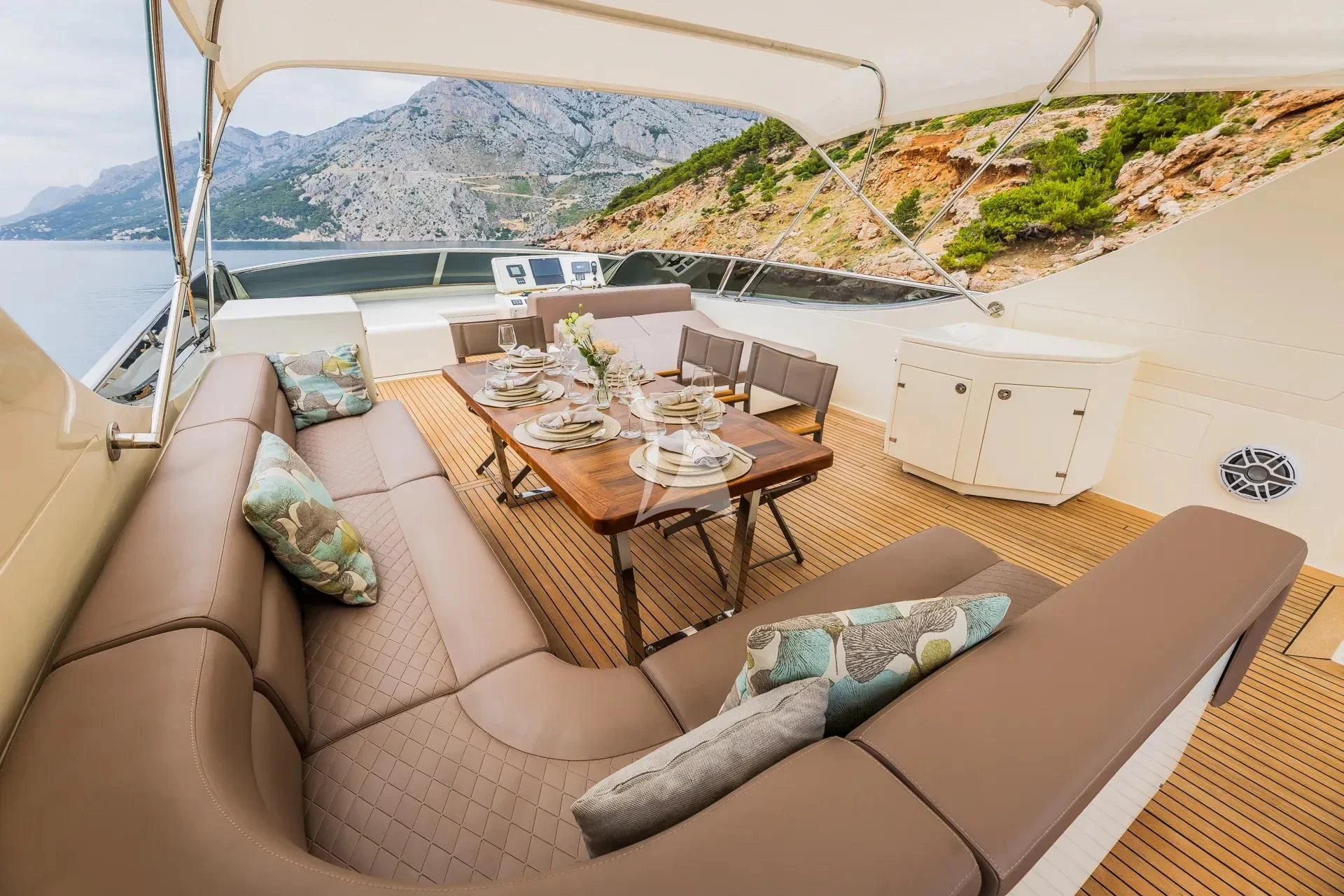 a living room with a couch and a table aboard KARISMA Yacht for Sale