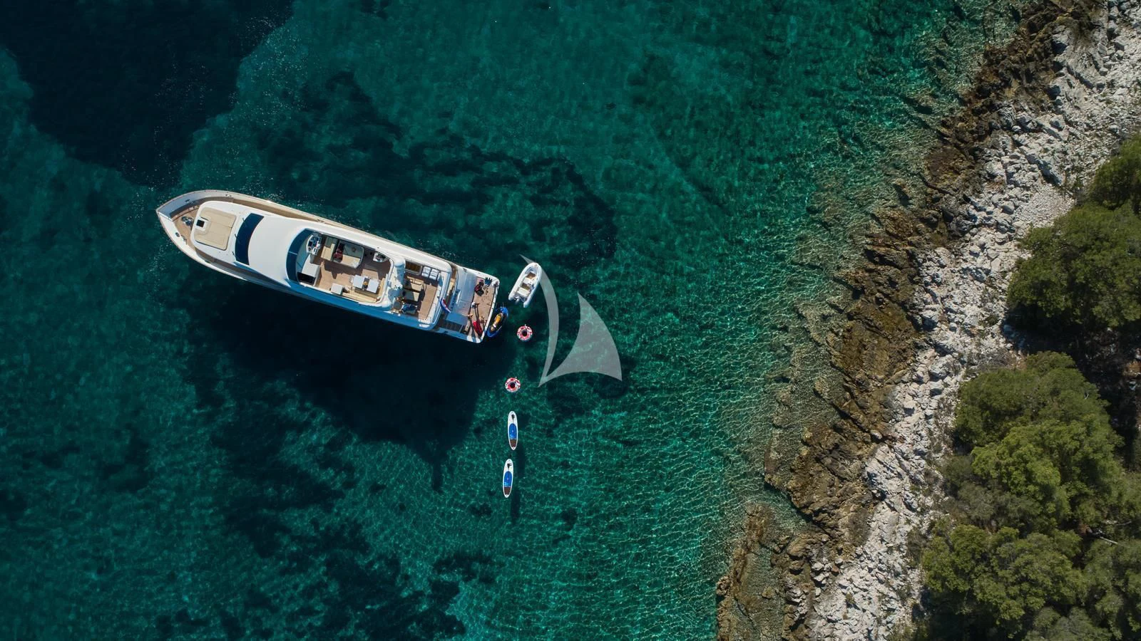 a group of people on a boat in the water aboard KARISMA Yacht for Sale