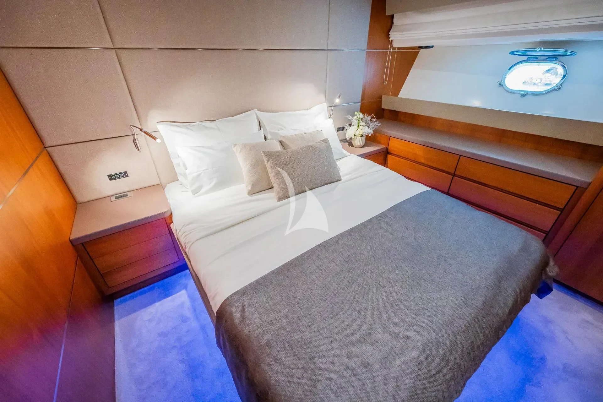a bed with a white comforter aboard KARISMA Yacht for Sale