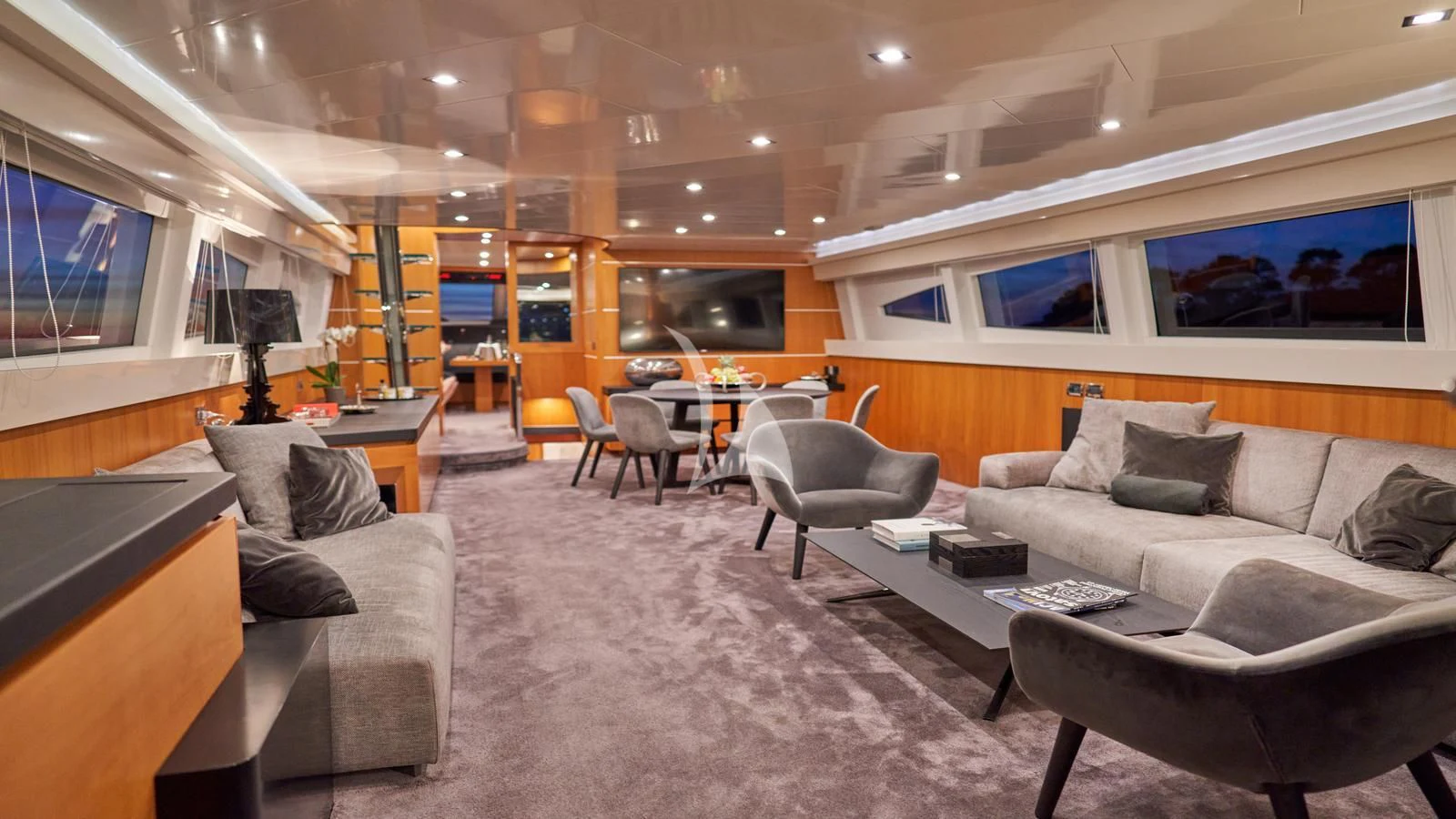 a living room with a couch and a tv aboard KARISMA Yacht for Sale