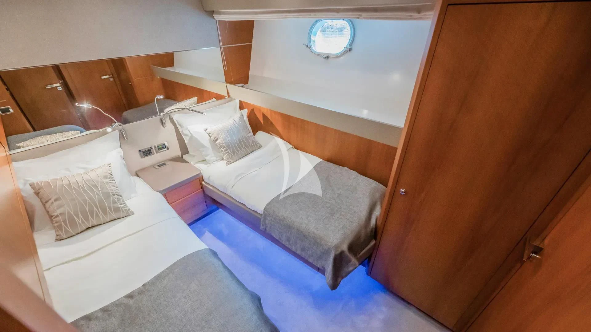 a room with a bed and a mirror aboard KARISMA Yacht for Sale