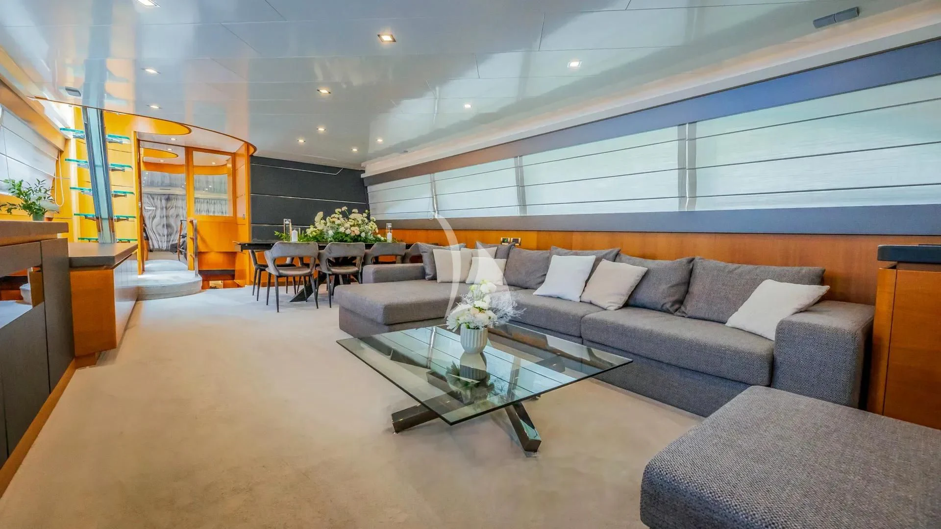 a living room with a couch and a coffee table aboard KARISMA Yacht for Sale