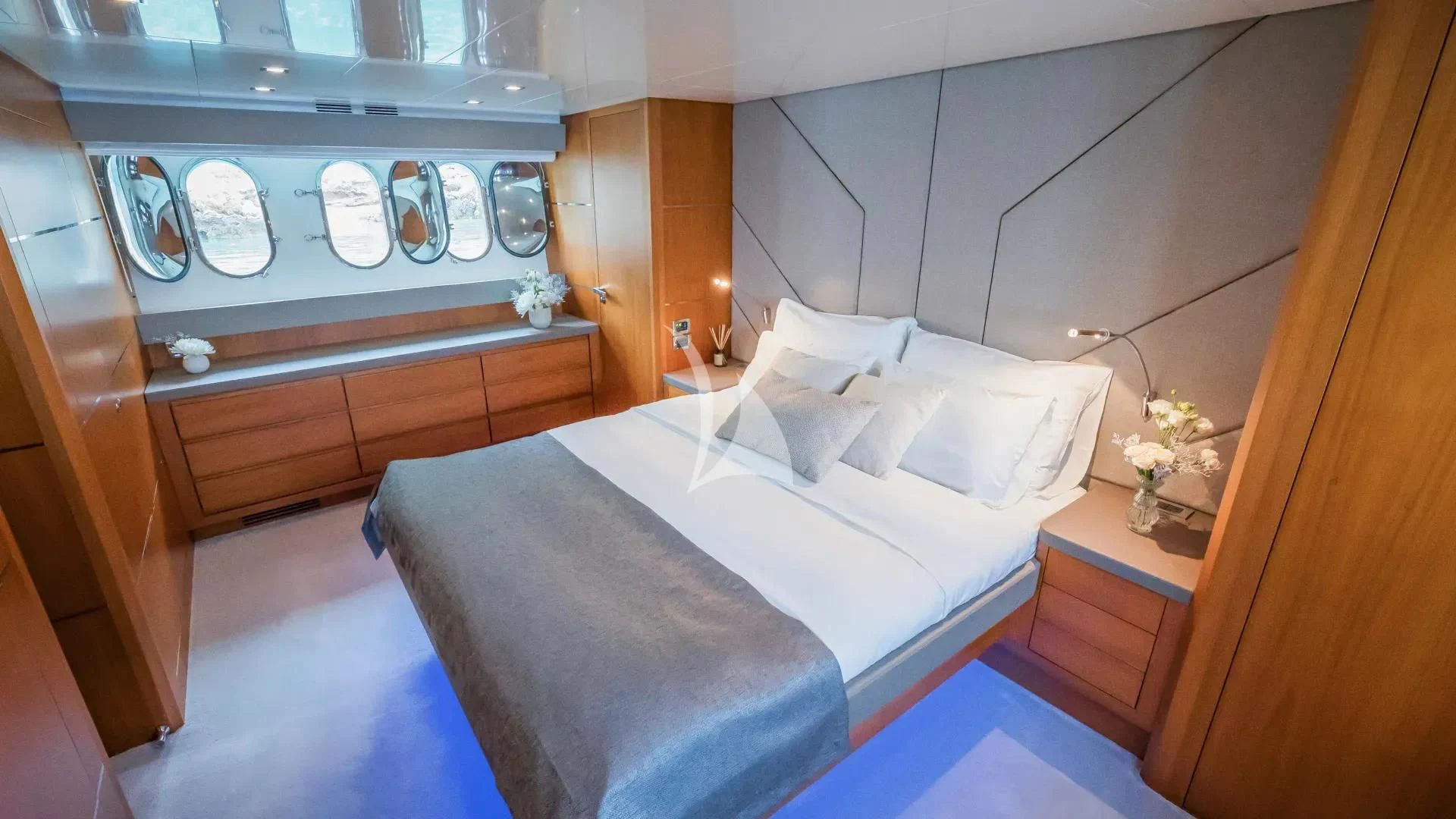 a room with a bed and cabinets aboard KARISMA Yacht for Sale