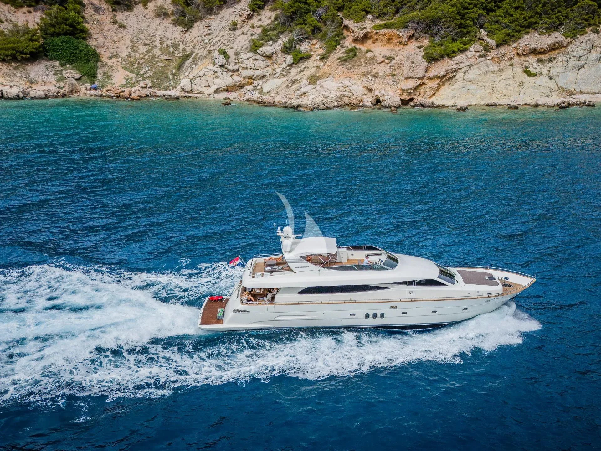 a white boat on water aboard KARISMA Yacht for Sale