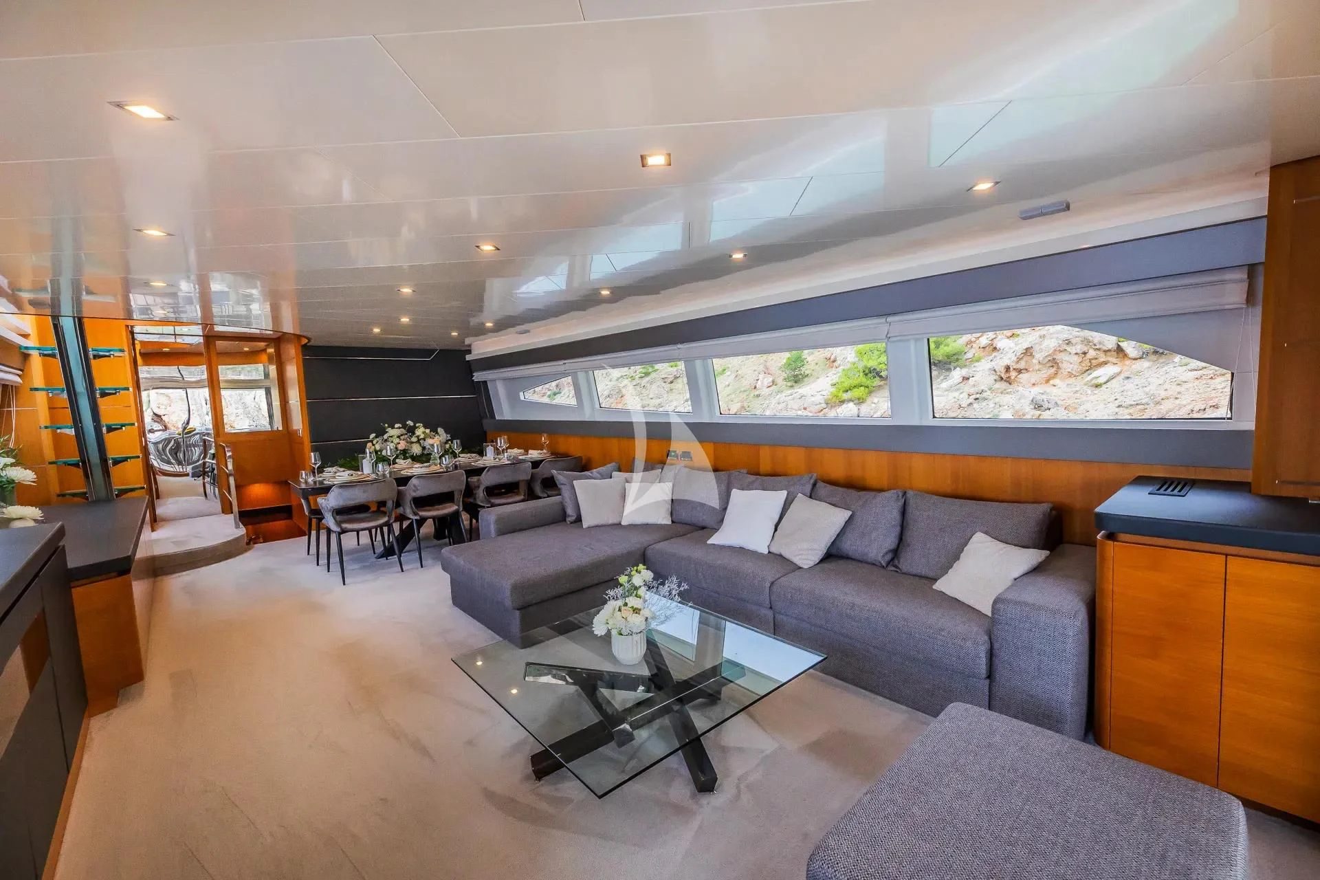 a living room with a large window aboard KARISMA Yacht for Sale