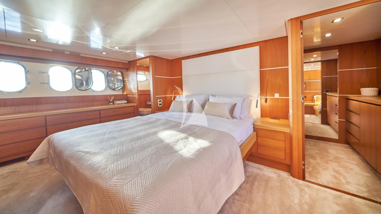 a room with a bed and a mirror aboard KARISMA Yacht for Sale