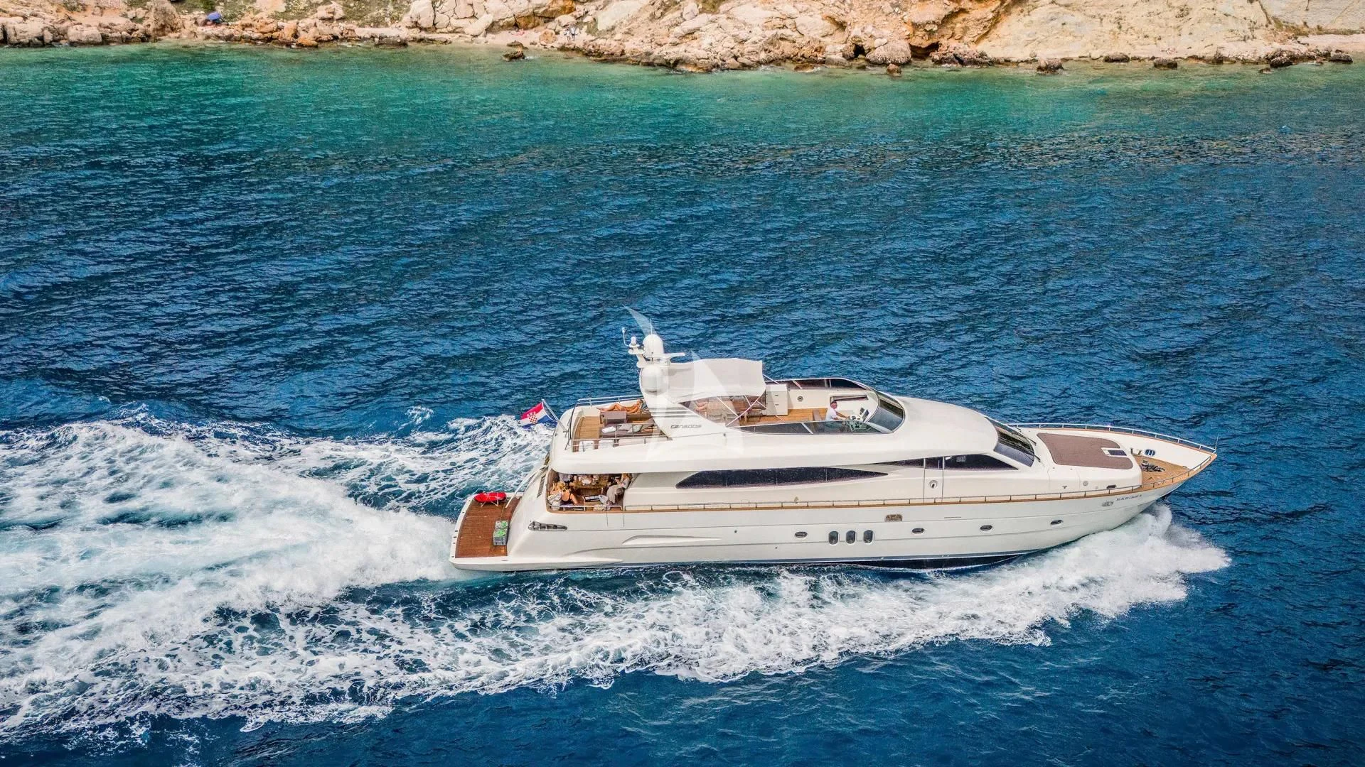 a white yacht on the water aboard KARISMA Yacht for Sale