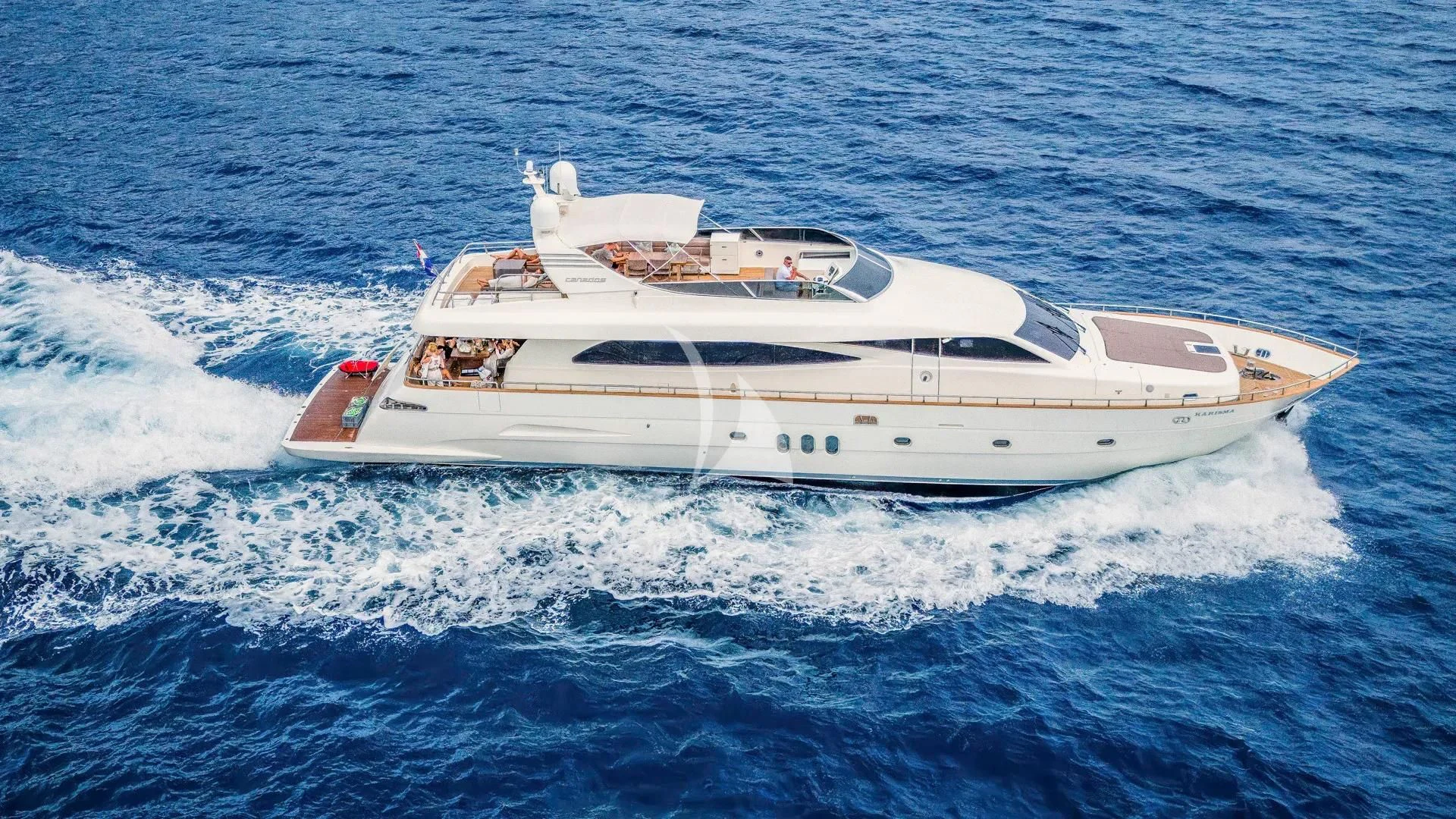 a white yacht on the water aboard KARISMA Yacht for Sale