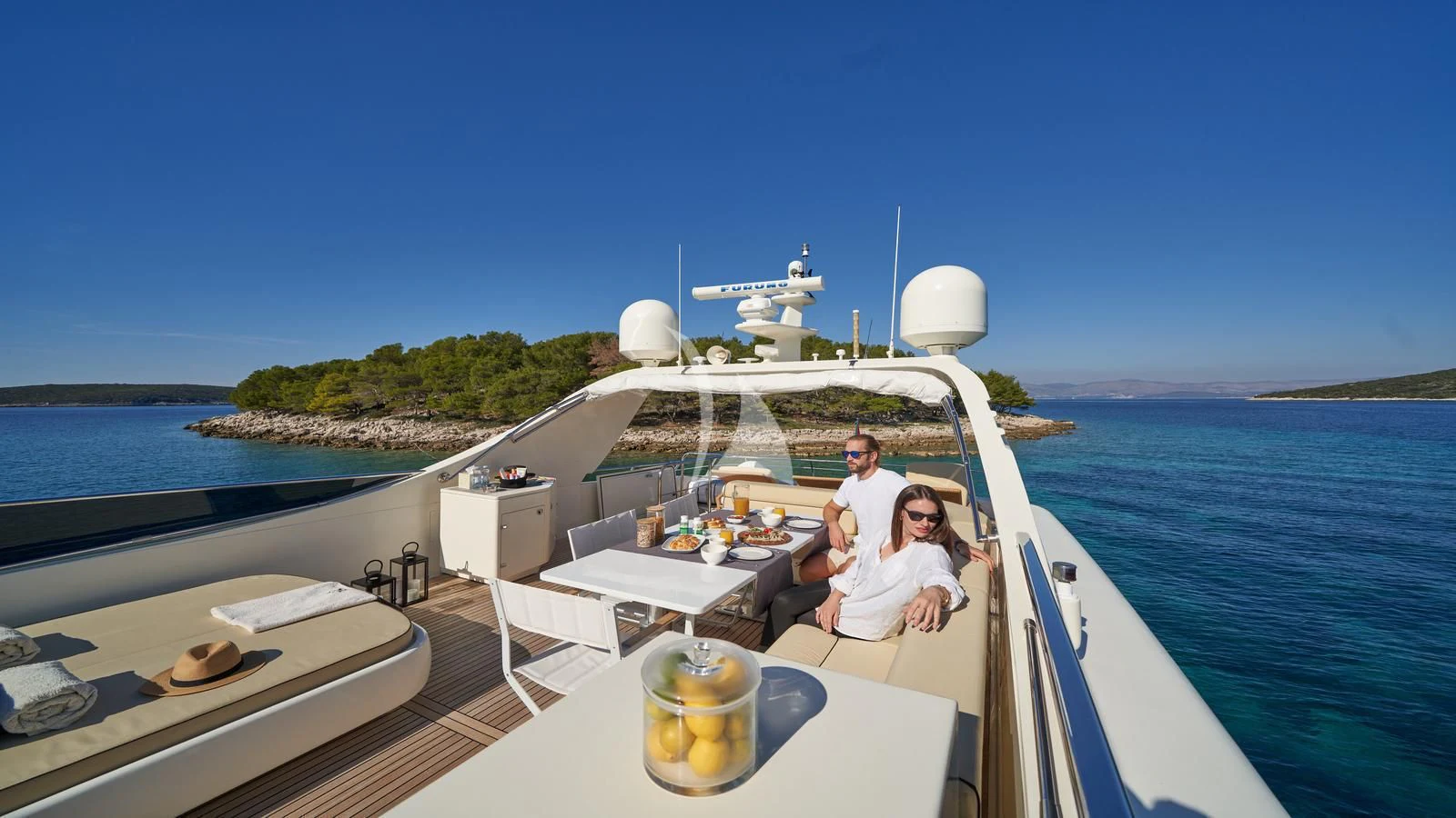 a couple sitting on a boat aboard KARISMA Yacht for Sale